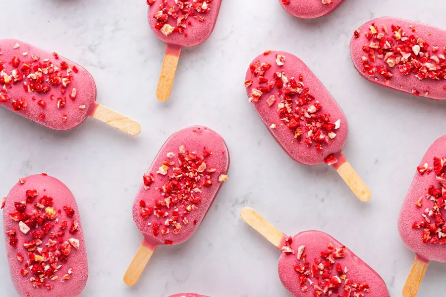 Beautiful red creamsicles on a table.